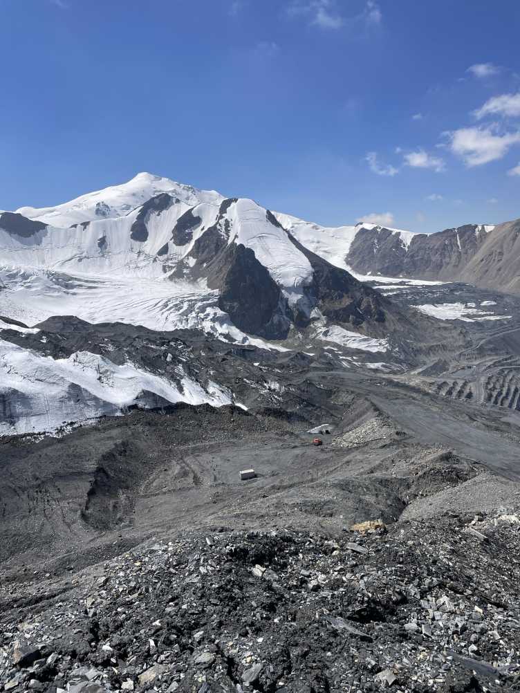 Tien Shan glacier with gold mines in front